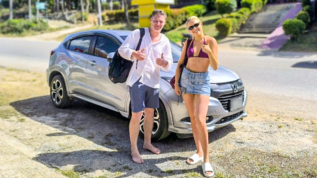Lanta Car Rental - Satisfied traveler with Lanta Car Rental vehicle, ready to explore Koh Lanta attractions